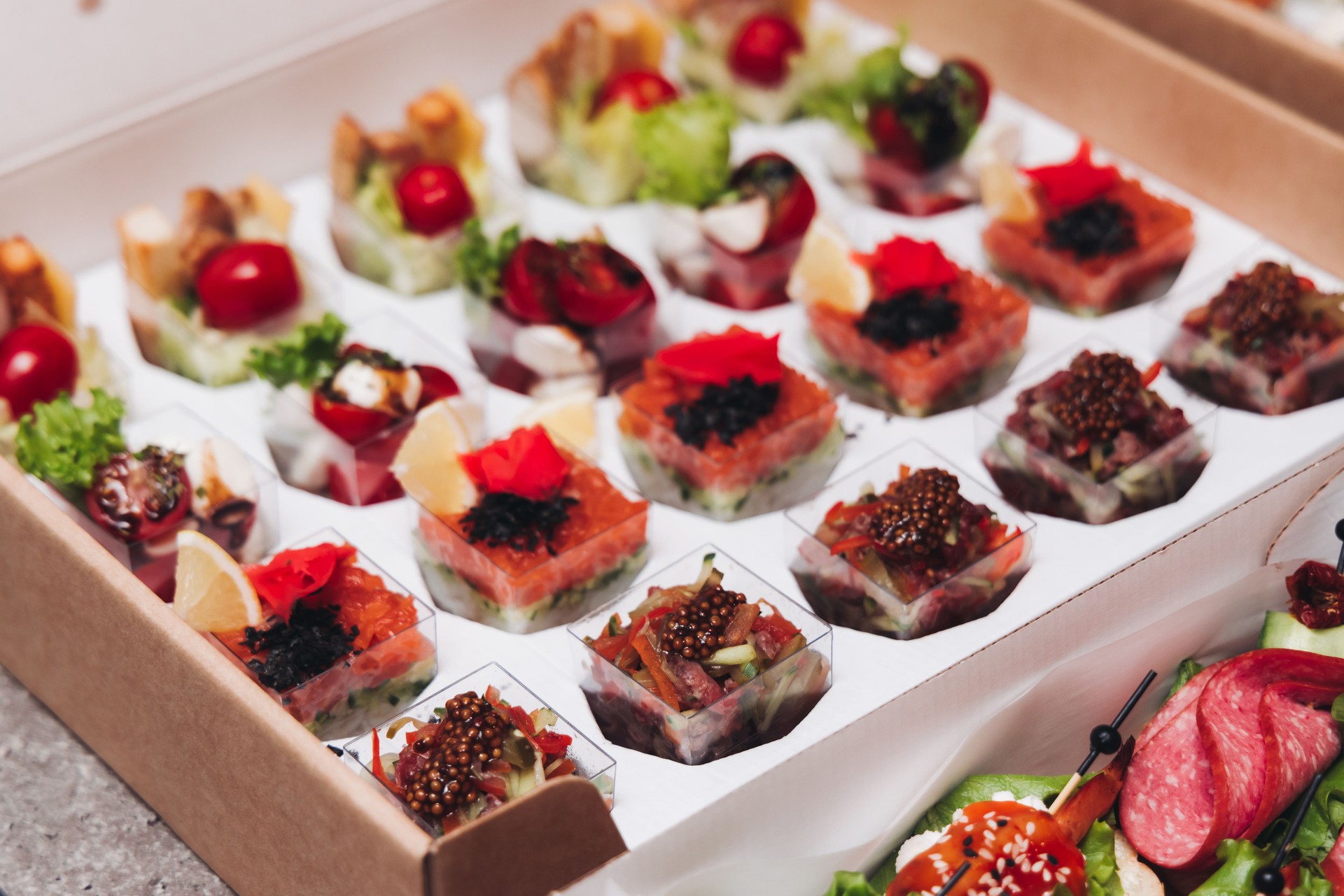 Catering table, beautifully decorated banquet with variety different food snacks appetizers on christmas corporate birthday party event or wedding celebration, canape, salad, delicatessen setting